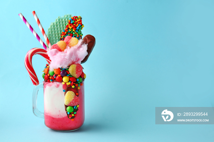 Delicious freak shake on color background