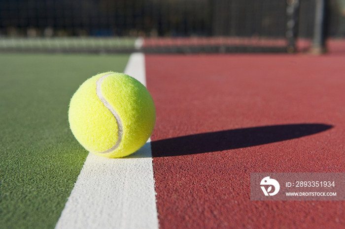 Tennis Ball Sitting on Court