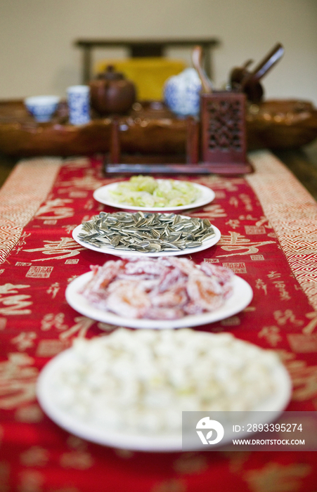 Asian Dishes Down a Table