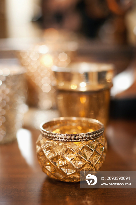 Close-up of candle holders on table against blurred background at home; Scottsdale; USA