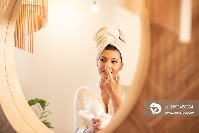 Young beautiful woman in bathroom.