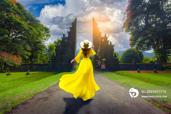 Asian female tourists visit Bali gate in Bali,Indonesia.