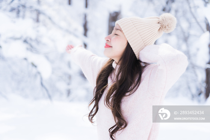 Portrait Young Beautiful asian woman smile happy travel and enjoy with snow winter season