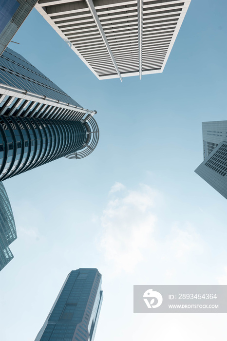 Bottom view to modern skyscrapers at downtown district. Business below background. Singapore city