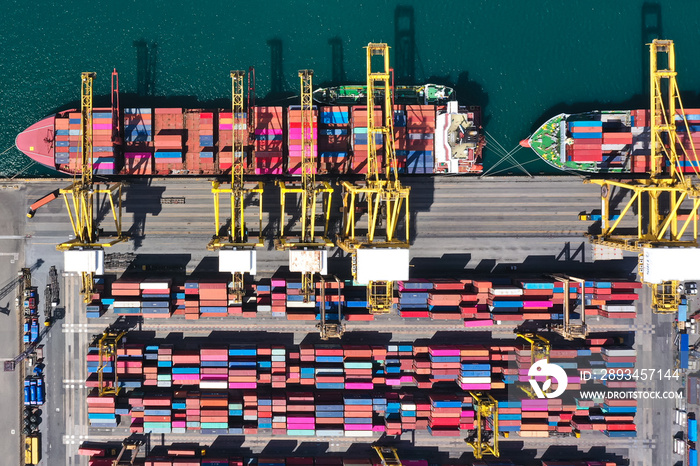 Aerial top view over international cargo ship at industrial import-export port prepare to load conta