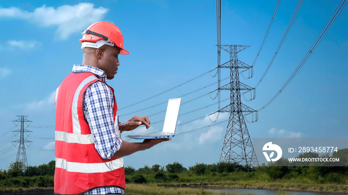 Electrical engineer man standing and planing renewable energy technology at a power station for futu