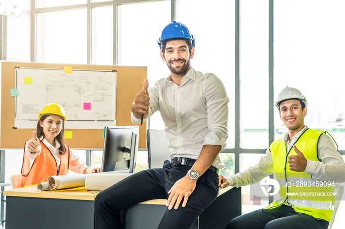 Asian young engineer group of home building member discuss for project planning. Smile man sitting s