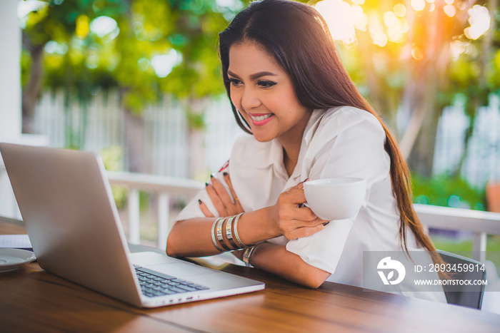 Happy smile Asian business woman using laptop at cafe, Vacation businesswoman working at home, Beaut