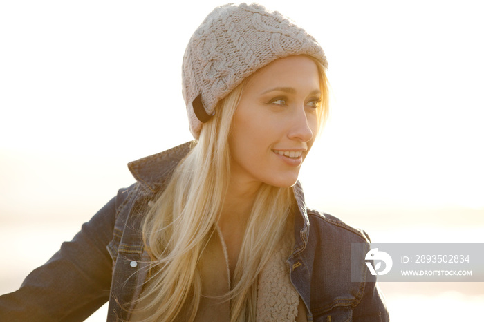 Portrait of young woman wearing knit hat