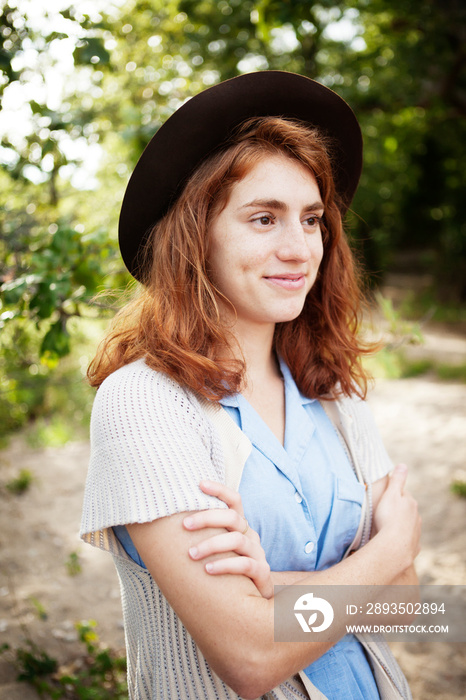 Young woman with arms crossed