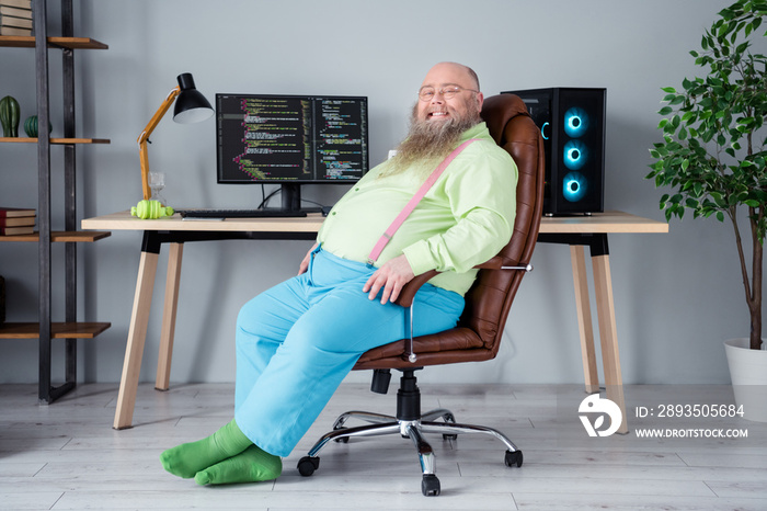 Photo of positive overweight guy sit chair computer screen code scripts finish work home office work