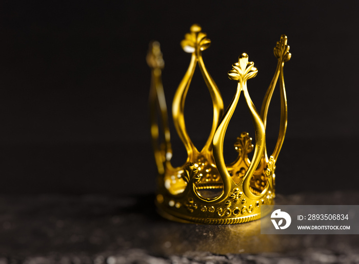 Golden crown with dark background