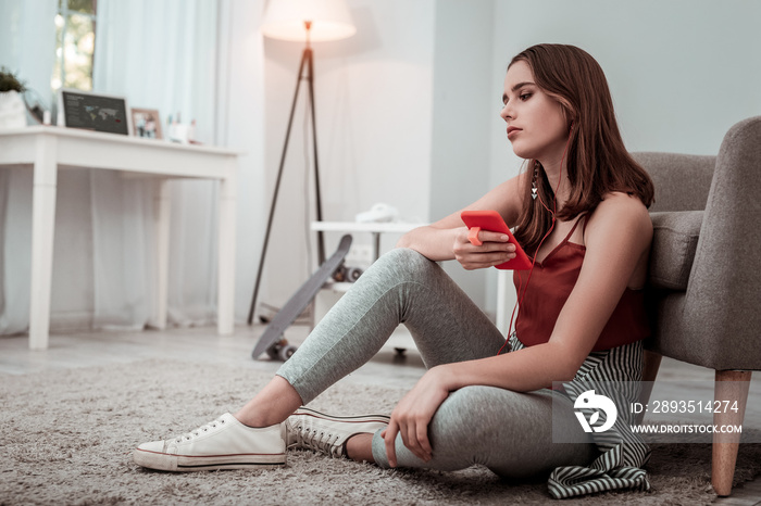 Woman in earphones listening to the music