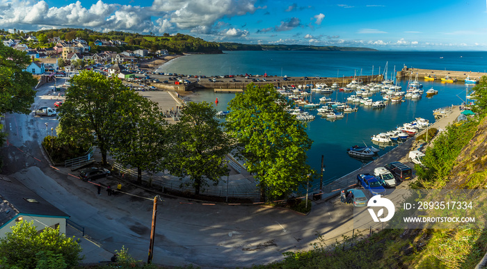 The harbour and village of Saundersfoot, Wales highlighted by the evening sun in summertime