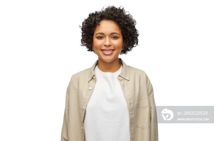 people, ethnicity and portrait concept - happy smiling woman in shirt over white background