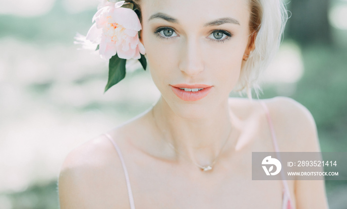 portrait of young woman with flower