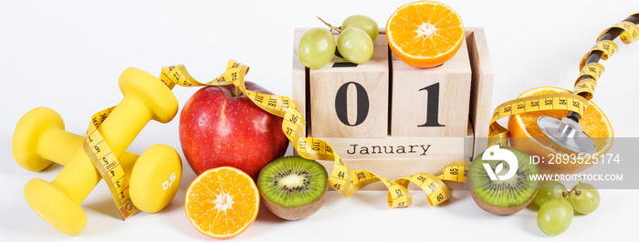 Cube calendar, fruits, dumbbells and tape measure, new years resolutions