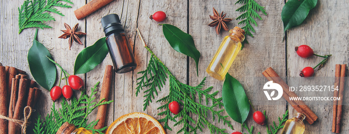 Christmas essential oils in a small bottle. Selective focus.