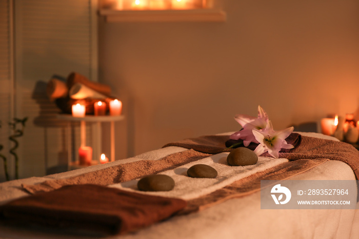 Interior of modern massage room in candle light