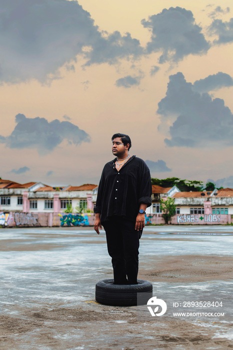 portrait of dark skinned Indian man on rooftop