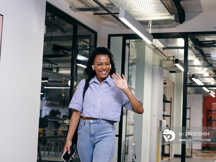 Woman walking in office hallway