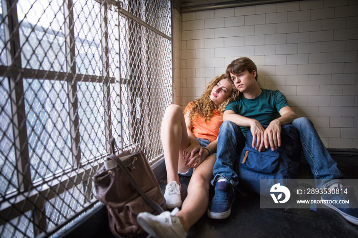 Young couple sitting indoors