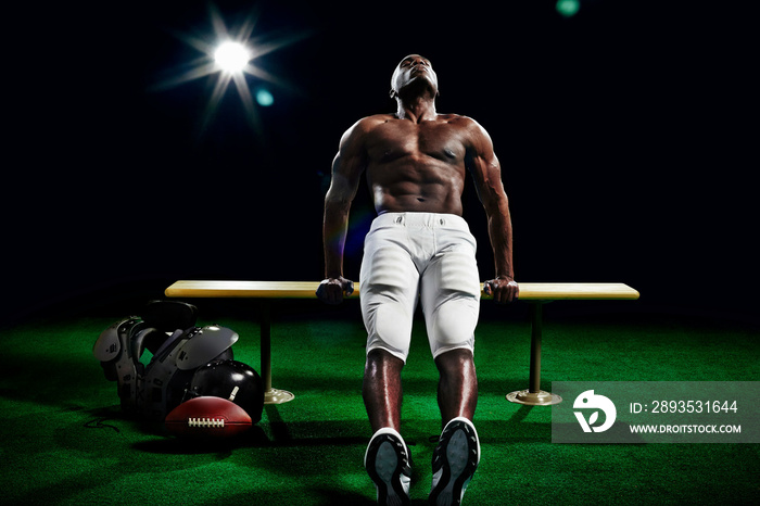 Portrait of american football player doing push ups