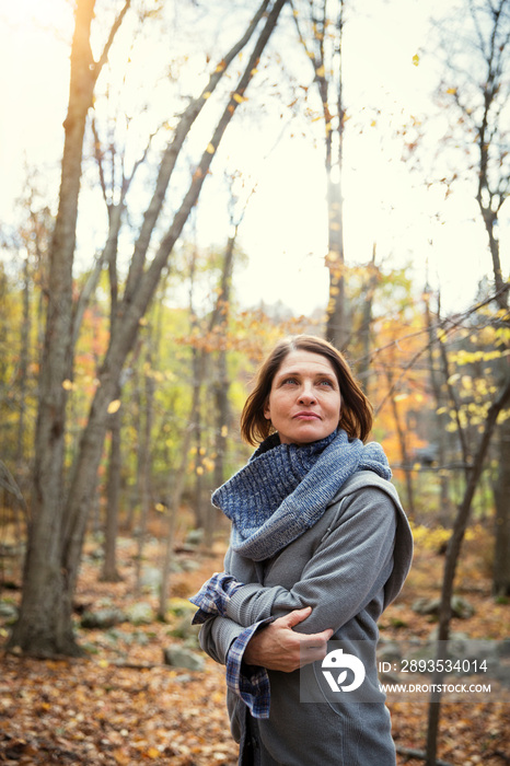 Woman walking in forest