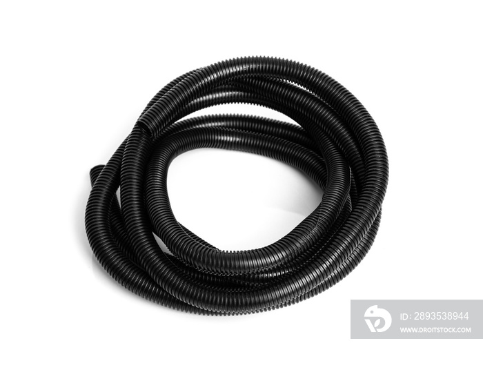 Corrugated black plastic hose for electrical wiring on a white background.