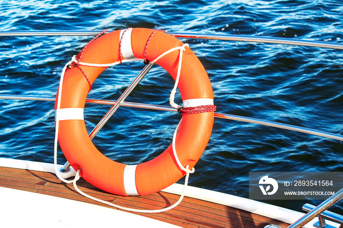 Safety equipment on a boat, life buoy or rescue buoy floating on sea. Concept to rescue people from 