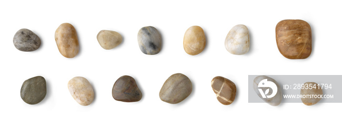 Up view of different river stones collection against white background