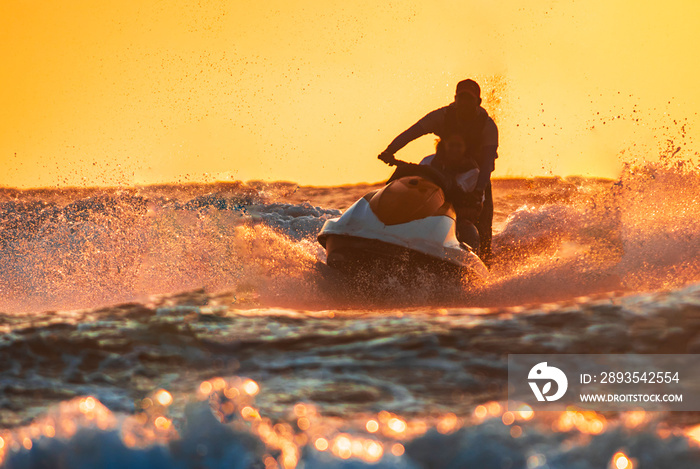 Man jet skiing in tropical water in Goa at baga beach