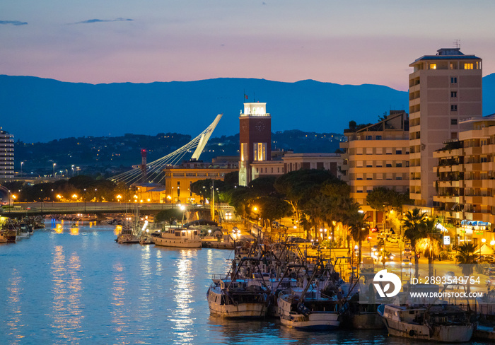 Pescara (Italy) - The view in the dusk from Ponte del Mare monumental bridge in the canal and port o