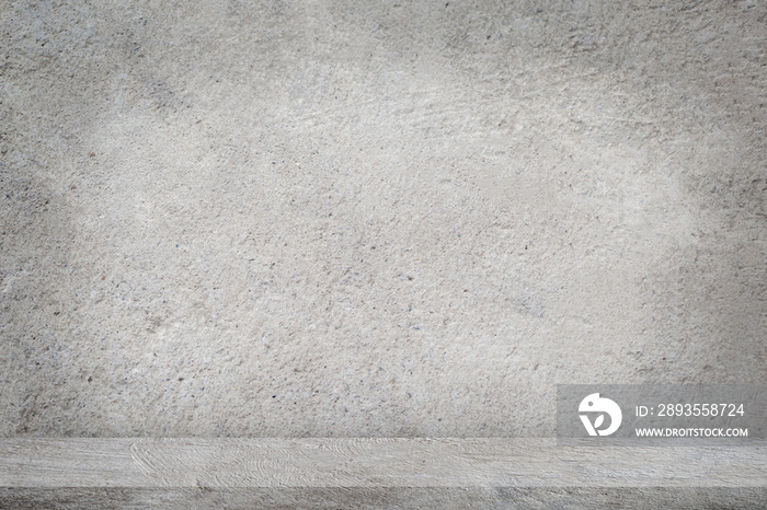 Concrete floor with empty grey concrete wall background.