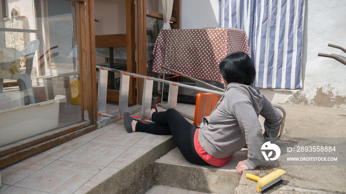 accidents while cleaning domestic house where a caucasian girl falls off the ladder with broom and d