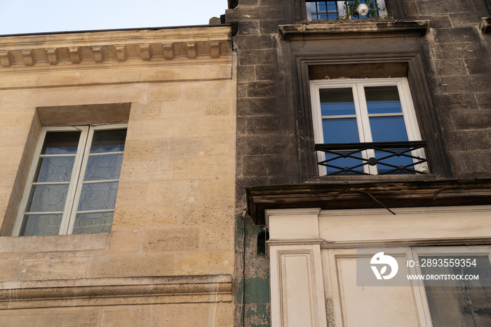 wash cleaned building house facade and a dirty one in a city town before and after