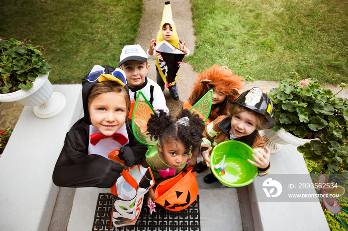 Portrait of children in fancy dress costumes on Halloween