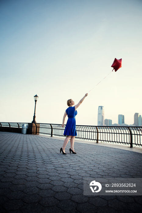 Woman holding balloon