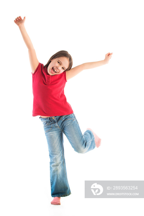 Happy child posing standing on one leg