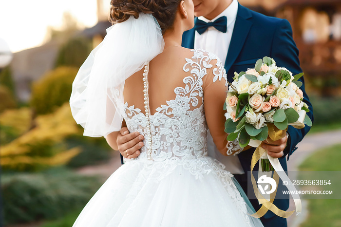 Amazing wedding couple. Pretty bride and stylish groom. selective focus