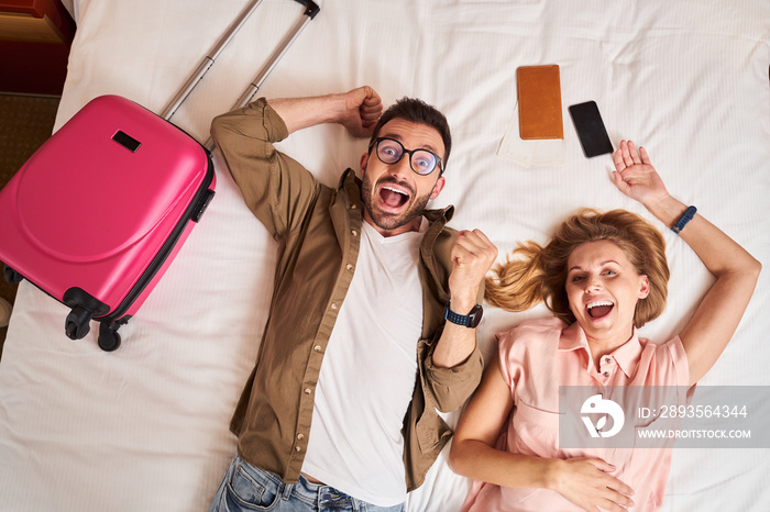 Happy young couple enjoying arrival at hotel