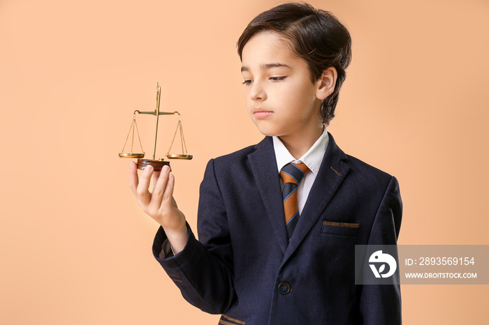 Little lawyer with scales of justice on color background