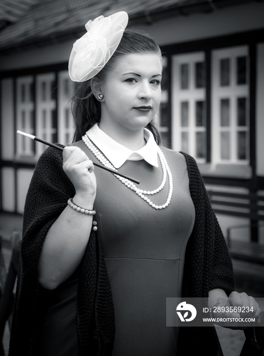 Attractive woman in vintage style clothes