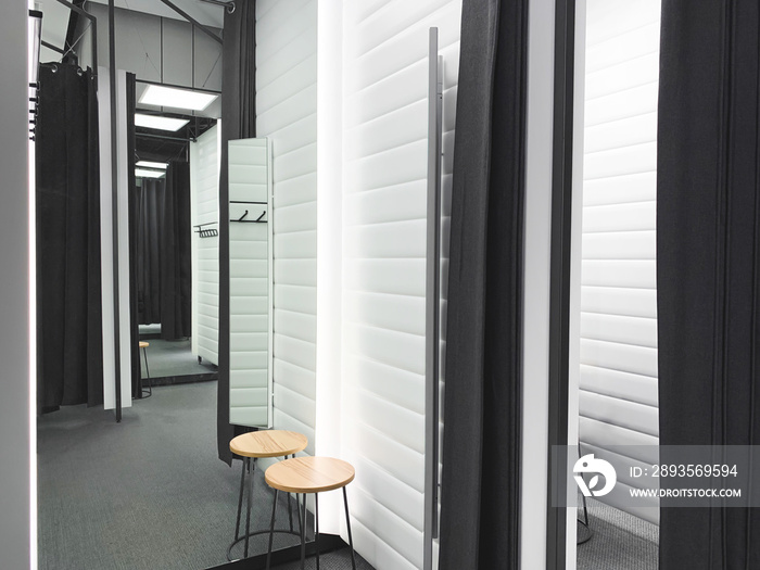 Fitting room in a clothing store. Shopping concept. Interior of the dressing room in a mall