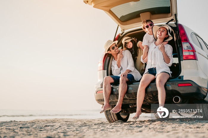 Happy asian family on a road trip in their car. Dad, mom and daughter are traveling by the sea. Summ