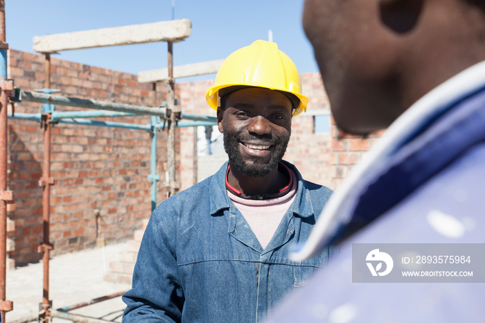 Builders talking on construction site