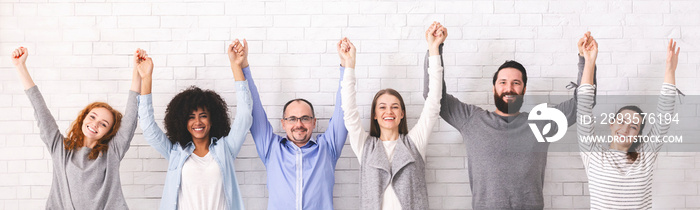 Success of togetherness. Group of millennials holding hands