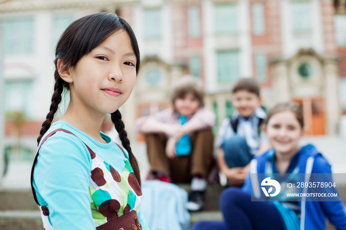 Elementary students outside of school building