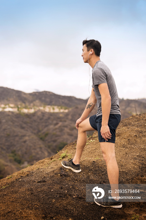 Man exercising and listening to music