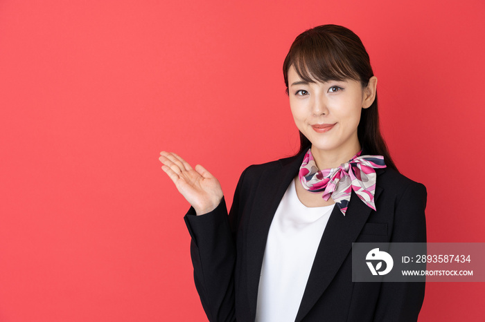 portrait of asian businesswoman isolated on red background